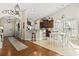 Open concept kitchen with tile floors, a breakfast bar, pendant lights, and views into the dining area at 1412 Rainsbrook Ct., Conway, SC 29526