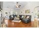 Spacious living room featuring a vaulted ceiling, hardwood floors, and a comfortable sectional sofa at 1412 Rainsbrook Ct., Conway, SC 29526
