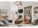 Cozy living room with hardwood floors, a fireplace, and an open view into the kitchen area at 1412 Rainsbrook Ct., Conway, SC 29526