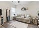 Cozy living room with a comfortable sofa, modern decor, and a large window for natural light at 1412 Rainsbrook Ct., Conway, SC 29526