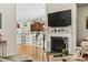 Cozy living room with fireplace and decor, an open view into the kitchen and breakfast bar at 1412 Rainsbrook Ct., Conway, SC 29526