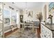Bright home office with large window, desk, chandelier, and ample natural light at 1412 Rainsbrook Ct., Conway, SC 29526