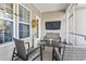 Inviting screened porch with comfortable seating, perfect for relaxing and entertaining outdoors at 1412 Rainsbrook Ct., Conway, SC 29526