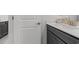 Modern bathroom featuring a dark vanity, white countertop, and sleek fixtures offering a stylish and functional space at 1414 Villena Dr., Myrtle Beach, SC 29579