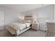 Inviting bedroom with light wood furniture, soft bedding, and natural light creates a cozy and relaxing atmosphere at 1414 Villena Dr., Myrtle Beach, SC 29579
