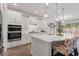 Modern kitchen with white cabinets, quartz countertops, stainless steel appliances, and a stylish island with seating at 1414 Villena Dr., Myrtle Beach, SC 29579