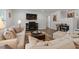 A cozy living room features hardwood floors, comfortable seating, and a fireplace with mounted TV at 1414 Villena Dr., Myrtle Beach, SC 29579
