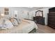 Comfortable main bedroom featuring a large bed, dresser, nightstands, and hardwood floors at 1414 Villena Dr., Myrtle Beach, SC 29579