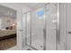 A modern shower featuring a glass enclosure, bench, and tiled walls at 1414 Villena Dr., Myrtle Beach, SC 29579