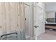 Bathroom with a shower showcasing a patterned curtain, and a glimpse of the bedroom with a bed at 181 Ella Kinley Circle # 305, Myrtle Beach, NY 29588