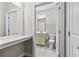 Bathroom featuring white cabinetry, toilet, vanity, and sink, with a tiled floor at 181 Ella Kinley Circle # 305, Myrtle Beach, NY 29588
