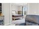 Cozy bedroom with a queen-sized bed, wooden furniture, plush carpet, and a sunlit window at 181 Ella Kinley Circle # 305, Myrtle Beach, NY 29588