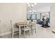 Open-concept dining area flowing into a spacious living room with abundant natural light at 181 Ella Kinley Circle # 305, Myrtle Beach, NY 29588