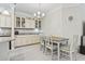 Charming dining area with stylish lighting, table and granite countertops at 181 Ella Kinley Circle # 305, Myrtle Beach, NY 29588
