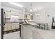 Kitchen with an island, granite countertops, stainless steel appliances, and an adjacent dining area at 181 Ella Kinley Circle # 305, Myrtle Beach, NY 29588