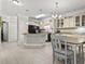 Bright kitchen with a granite island, stainless steel appliances, and modern cabinetry at 181 Ella Kinley Circle # 305, Myrtle Beach, NY 29588