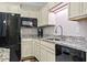 Kitchen with granite countertops, white cabinetry, stainless steel appliances, and neutral tones at 181 Ella Kinley Circle # 305, Myrtle Beach, NY 29588