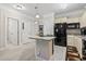 Kitchen featuring an island, granite countertops, stainless steel appliances, and white cabinetry at 181 Ella Kinley Circle # 305, Myrtle Beach, NY 29588