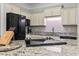Well-equipped kitchen featuring granite countertops, stainless steel appliances, and updated cabinetry at 181 Ella Kinley Circle # 305, Myrtle Beach, NY 29588