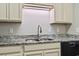 Close up on the kitchen sink with granite countertops, stainless steel appliances, and cabinets at 181 Ella Kinley Circle # 305, Myrtle Beach, NY 29588