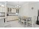 Open-concept dining area and pantry under a chandelier at 181 Ella Kinley Circle # 305, Myrtle Beach, SC 29588