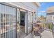Cozy balcony with outdoor seating and views of the surrounding area at 1890 Colony Dr. # 17T, Surfside Beach, SC 29575