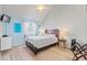 Cozy bedroom with a queen bed, natural light, and modern decor for a relaxing retreat at 1890 Colony Dr. # 17T, Surfside Beach, SC 29575