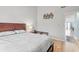 Comfortable bedroom with a queen bed, bedside table, and an en-suite bathroom entrance at 1890 Colony Dr. # 17T, Surfside Beach, SC 29575
