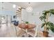 Open dining area with a round table, seating for six, and a unique spiral staircase at 1890 Colony Dr. # 17T, Surfside Beach, SC 29575