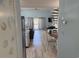 Bright living space with an open floor plan, spiral staircase, and access to the balcony at 1890 Colony Dr. # 17T, Surfside Beach, SC 29575