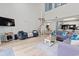 Spacious living area features a spiral staircase, modern décor, and convenient access to dining at 1890 Colony Dr. # 17T, Surfside Beach, SC 29575