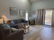 Comfortable living room with a large sofa, inviting armchairs, and access to outdoor balcony at 1890 Colony Dr. # 17T, Surfside Beach, SC 29575