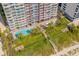 Stunning aerial view of a pool and grass area near a beach at 2007 S Ocean Blvd. # 2006, Myrtle Beach, SC 29577