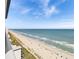 Expansive balcony view of the beach with blue skies and ocean at 2007 S Ocean Blvd. # 2006, Myrtle Beach, SC 29577