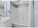Bright bathroom showcasing a tub and shower combination with white fixtures and a neutral color scheme at 2007 S Ocean Blvd. # 2006, Myrtle Beach, SC 29577