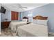 Bedroom features two beds with a ceiling fan and neutral tones at 2007 S Ocean Blvd. # 2006, Myrtle Beach, SC 29577