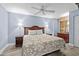 Cozy bedroom featuring a king-sized bed with lamps on both sides and wood-look flooring at 2007 S Ocean Blvd. # 2006, Myrtle Beach, SC 29577