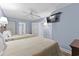 Bright bedroom with two beds, and a TV. Features a ceiling fan and an ensuite bath at 2007 S Ocean Blvd. # 2006, Myrtle Beach, SC 29577