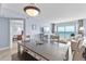 A beautifully furnished dining room with ocean view access to a patio at 2007 S Ocean Blvd. # 2006, Myrtle Beach, SC 29577