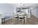 Open dining area and kitchen create a welcoming space for enjoying a delicious meal at 2007 S Ocean Blvd. # 2006, Myrtle Beach, SC 29577