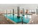 Bright indoor pool area with brick tiling and expansive windows at 2007 S Ocean Blvd. # 2006, Myrtle Beach, SC 29577