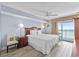 The main bedroom features a king bed and balcony access with ocean views at 2007 S Ocean Blvd. # 2006, Myrtle Beach, SC 29577