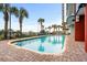 Beautiful outdoor pool surrounded by lush palm trees and greenery at 2007 S Ocean Blvd. # 2006, Myrtle Beach, SC 29577