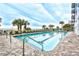 Inviting outdoor pool surrounded by lounge chairs and palm trees, creating a serene resort-style atmosphere at 2201 S Ocean Blvd. # 2010-2011, Myrtle Beach, SC 29577