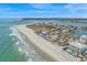 A breathtaking aerial view of the property, showcasing the beach, ocean, and surrounding community at 2201 S Waccamaw Dr., Murrells Inlet, SC 29576