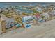 Stunning aerial view of a luxurious beach home with a pool, neighboring waterfront houses and ocean access at 2201 S Waccamaw Dr., Murrells Inlet, SC 29576