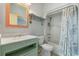 Bathroom featuring a shower-tub combination and a vanity with an ornate mirror at 2201 S Waccamaw Dr., Murrells Inlet, SC 29576