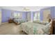 Bedroom with ample space, including two queen beds, light wood floors, and a beautiful ocean view at 2201 S Waccamaw Dr., Murrells Inlet, SC 29576