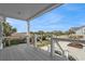 View from the covered deck of the property looking towards the street and neighboring homes at 2201 S Waccamaw Dr., Murrells Inlet, SC 29576