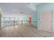 Bright foyer with light wood floors, ceiling fans, and large windows overlooking the water at 2201 S Waccamaw Dr., Murrells Inlet, SC 29576